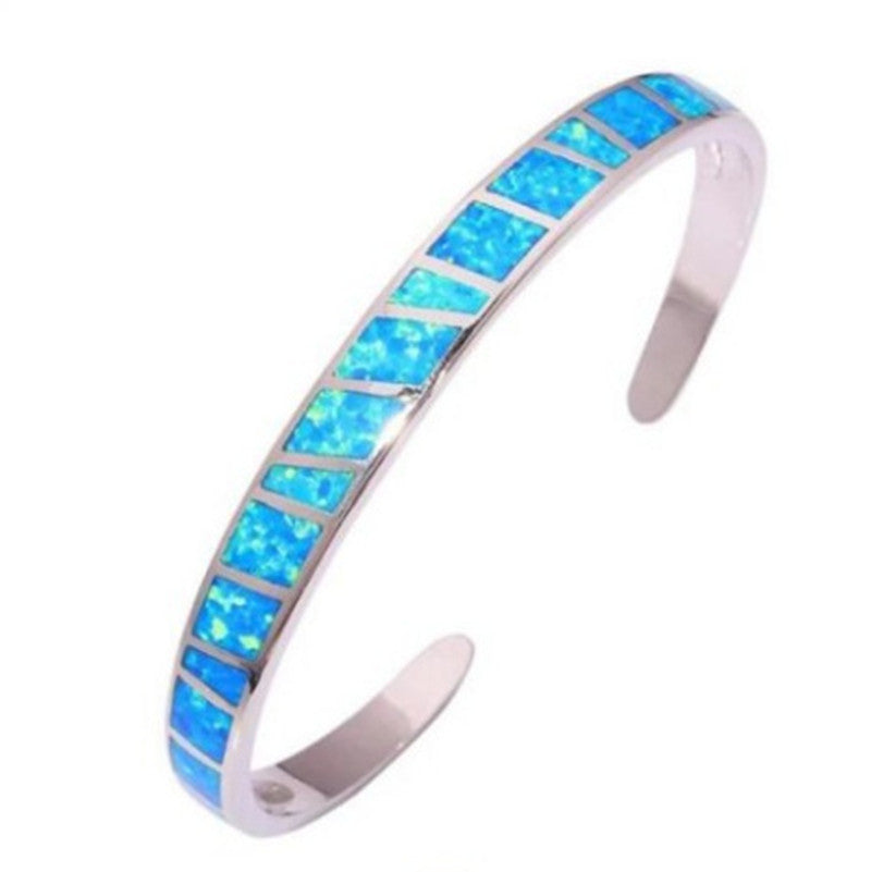 Open sterling silver bangle with blue opal mosaic in rectangular settings